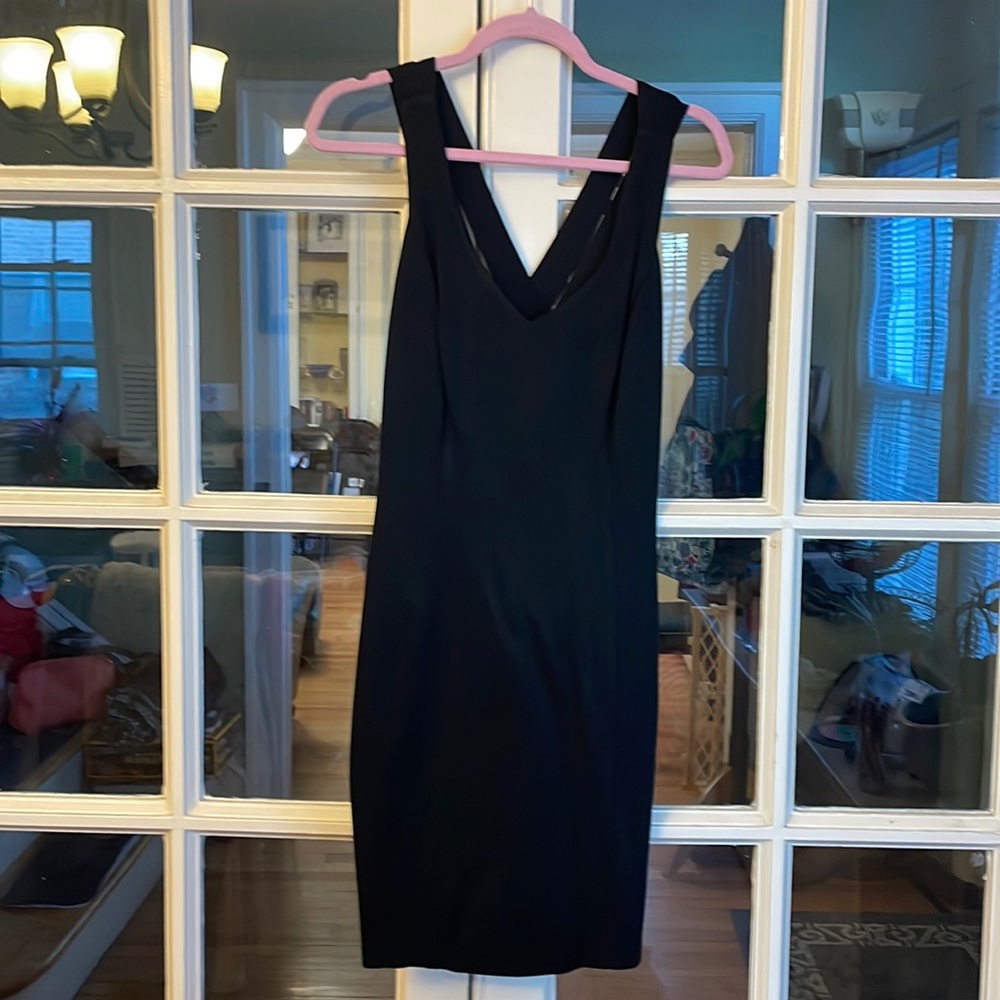 Miss Ashlee black dress size 10 with crossed straps in the back.